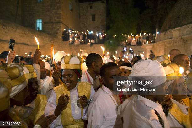 Ethiopian Orthodox Christians take part in the ceremony of the Holy Fire at the Ethiopian section of the Church of The Holy Sepulcheron April 7, 2018...