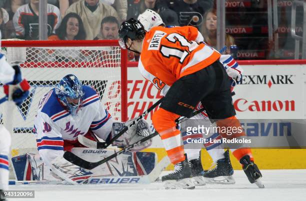 Michael Raffl of the Philadelphia Flyers attempts a scoring chance against Henrik Lundqvist and Neal Pionk of the New York Rangers on April 7, 2018...