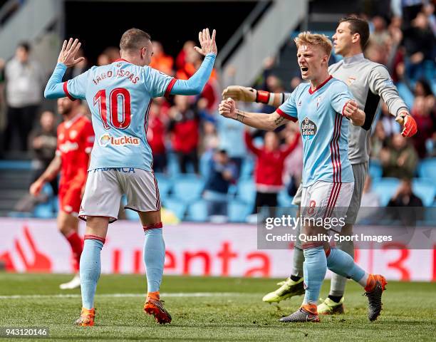 Iago Aspas and Daniel Wass of Celta de Vigo celebrate Guilherme Arana of Sevilla FC scores by own goal during the La Liga match between Celta de Vigo...