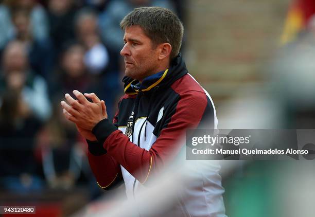 Captain Michael Kohlmann supports Tim Puetz and Jan-Lennard Struff of Germany in his match against Feliciano Lopez and Marc Lopez of Spain in the...