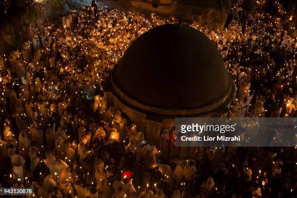 Ethiopian Orthodox Christians take part in the ceremony of the Holy Fire at the Ethiopian section of the Church of The Holy Sepulcheron April 7, 2018...