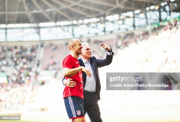 Jupp Heynckes head coach of Bayern Munich celebrates with Arjen Robben of Bayern Munich after victory in the Bundesliga match between FC Augsburg and...