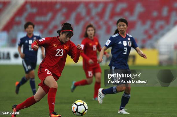 Japan's Aya SAMESHIMA competes with Vietnam's PHAM Hoang Quynh during their match for the AFC Women's Asian Cup Jordan 2018, in Amman, Jordan on...
