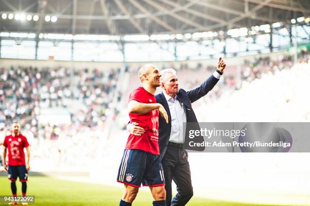 Jupp Heynckes head coach of Bayern Munich celebrates with Arjen Robben of Bayern Munich after victory in the Bundesliga match between FC Augsburg and...