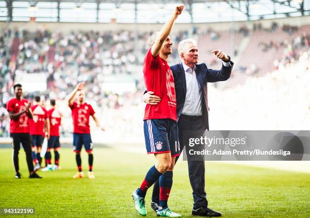 Jupp Heynckes head coach of Bayern Munich celebrates with Arjen Robben of Bayern Munich after victory in the Bundesliga match between FC Augsburg and...