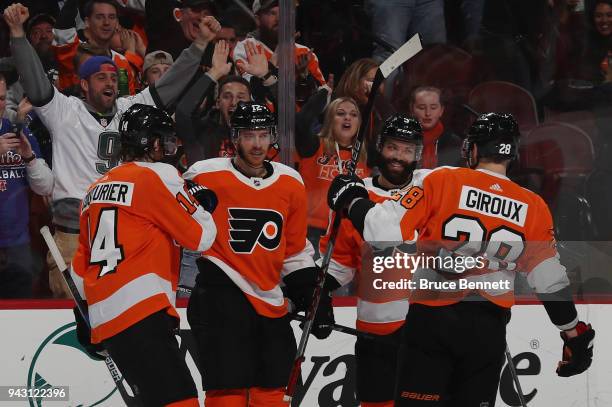 Sean Couturier, Michael Raffl, Radko Gudas and Claude Giroux of the Philadelphia Flyers celebrate a goal by Raffl at 17:53 of the second period...