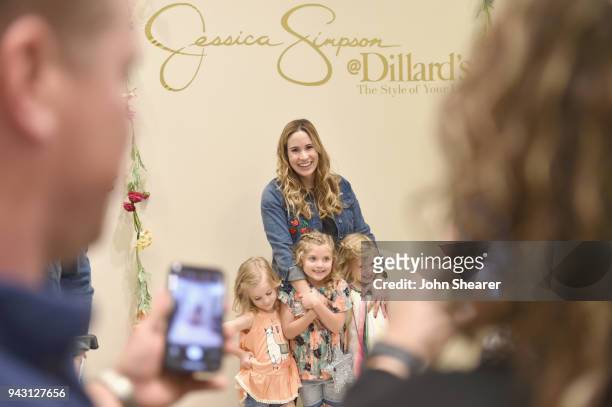 Jessica's Girls" take photos for fans during a spring style event for army wives and kids hosted by Jessica Simpson in Dillards at The Mall at Green...