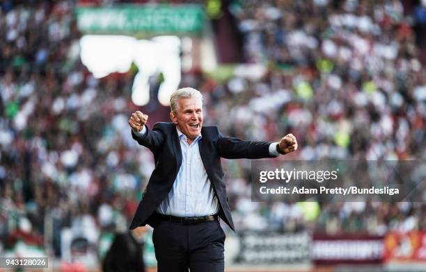 Jupp Heynckes head coach of Bayern Munich celebrates after Arjen Robben of Bayern Munich scored the third goal in the Bundesliga match between FC...