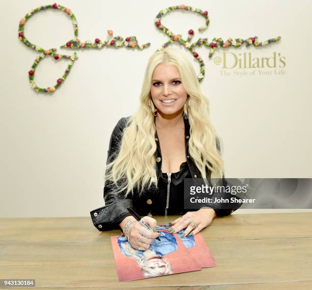 Jessica Simpson signs autographs for fans during a spring style event for army wives and kids in Dillards at The Mall at Green Hills hosted by...