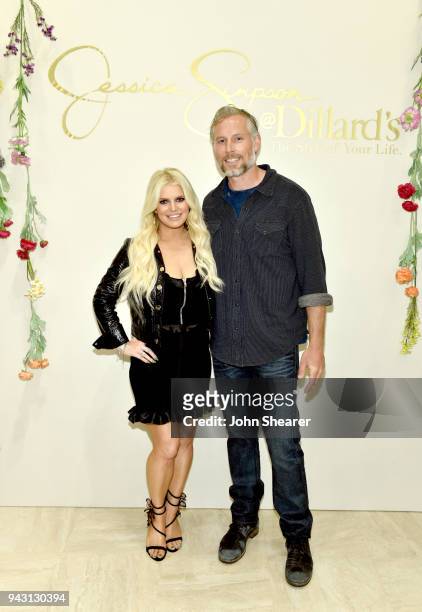Jessica Simpson and Eric Johnson take photos during a spring style event in Dillards at The Mall at Green Hills hosted by Jessica Simpson on April 7,...