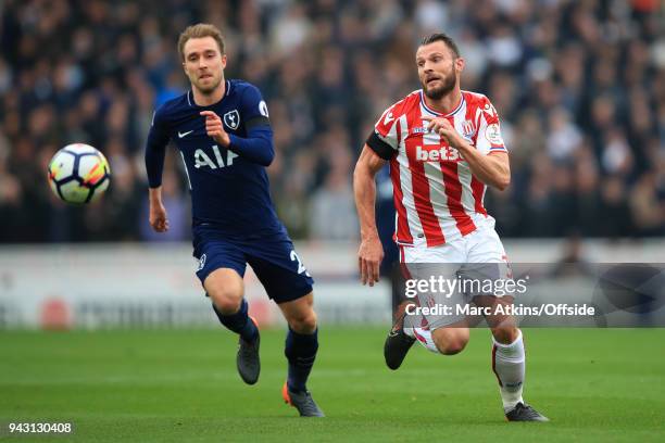 Christian Eriksen of Tottenham Hotspur in action with Erik Pieters of Stoke City during the Premier League match between Stoke City and Tottenham...