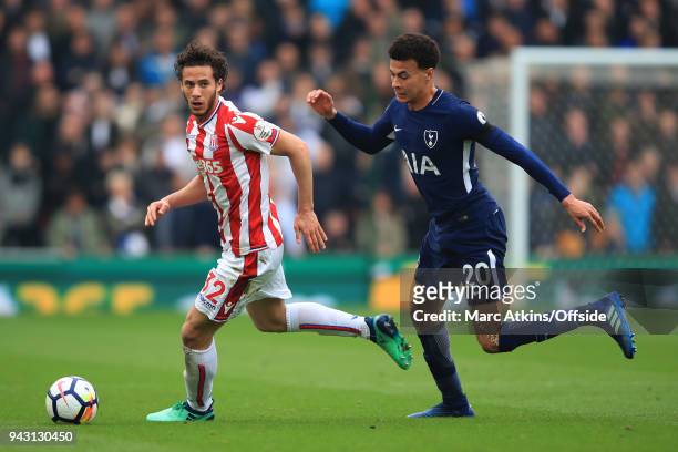 Ramadan Sobhi of Stoke City in action with Dele Alli of Tottenham Hotspur during the Premier League match between Stoke City and Tottenham Hotspur at...