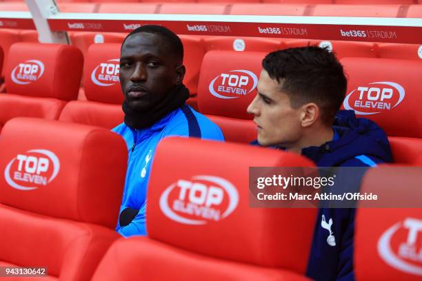 Moussa Sissoko and Erik Lamela of Tottenham Hotspur on the substitutes bench during the Premier League match between Stoke City and Tottenham Hotspur...