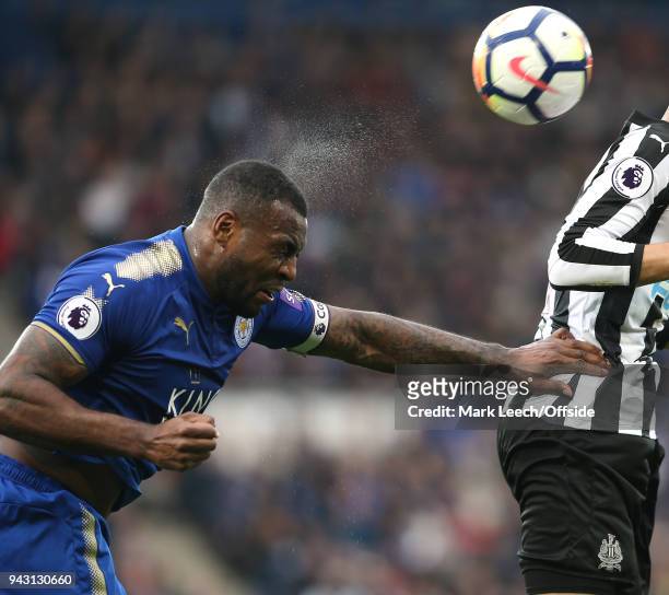 Spray comes off the head of Wes Morgan of Leicester as he heads the ball during the Premier League match between Leicester City and Newcastle United...