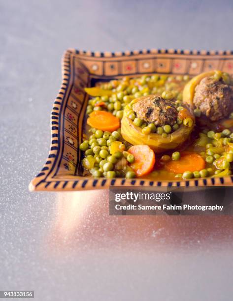 tajine of kefta with artichokes and peas - ground beef stew stock-fotos und bilder