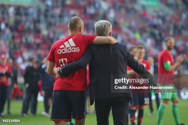 Jupp Heynckes, head coach of Bayern Muechen, celebrates in front of their supporters with Arjen Robben of Bayern Muenchen winning the 6th...