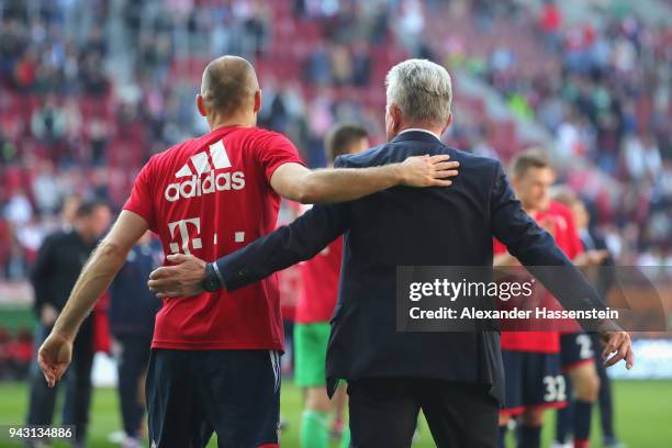 Jupp Heynckes, head coach of Bayern Muechen, celebrates in front of their supporters with Arjen Robben of Bayern Muenchen winning the 6th...