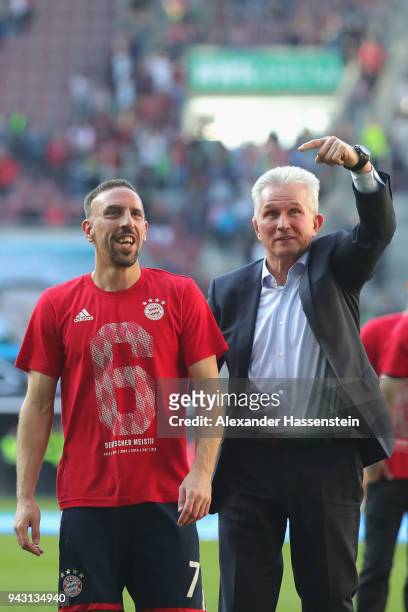 Jupp Heynckes, head coach of Bayern Muechen celebrates in front of their supporters with Franck Ribery of Bayern Muenchen winning the 6th...