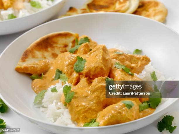 butter chicken with rice and naan - butter chicken rice stock pictures, royalty-free photos & images