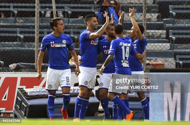 Cruz Azul's forward Spanish Edgar Mendez celebrates with teammates after scoring a goal against Lobos Buap during their Mexican Clausura 2018...