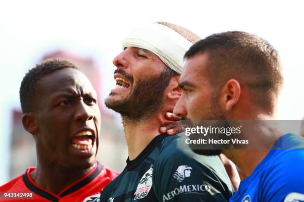 Lucero Alvarez of Lobos BUAP reacts after receiving a blow to the face that caused him a cut during the 14th round match between Cruz Azul and Lobos...