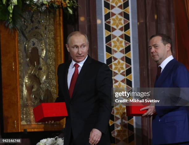 Russian President Vladimir Putin and Prime Minister Dmitry Medvedev attend the Orthodox Easter service in the Christ the Saviour Cathedral in Central...
