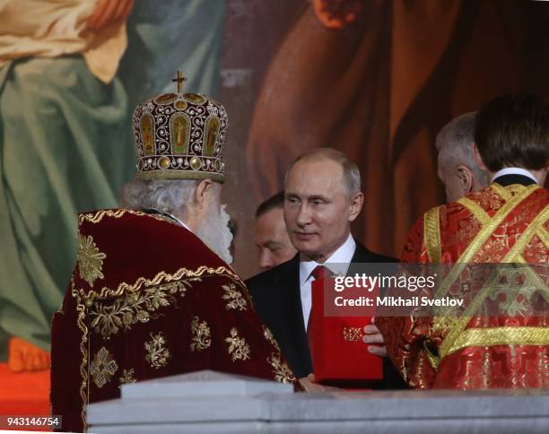 Russian President Vladimir Putin attends the Orthodox Easter service in the Christ the Saviour Cathedral in Central Moscow, Russia, April 8, 2018.