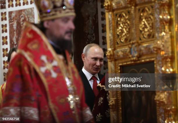 Russian President Vladimir Putin attends the Orthodox Easter service in the Christ the Saviour Cathedral in Central Moscow, Russia, April 8, 2018.