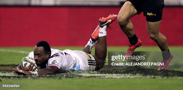 New Zealand's Crusaders wing Manasa Mataele scores a try against Argentina's Jaguares during their Super Rugby match at Jose Amalfitani stadium in...