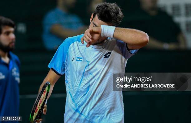 Argentina's Guido Pella gestures during the 2018 Davis Cup Americas Group second round single tennis match against Chile's Christian Garin, at Aldo...