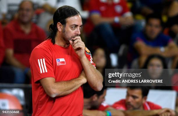 Chile's team captain Nicolás Massú gestures during their 2018 Davis Cup Americas Group second round single tennis match between Argentina's Guido...