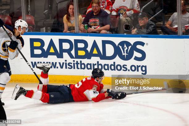 Henrik Borgstrom of the Florida Panthers skates for possession against Brendan Guhle of the Buffalo Sabres at the BB&T Center on April 7, 2018 in...