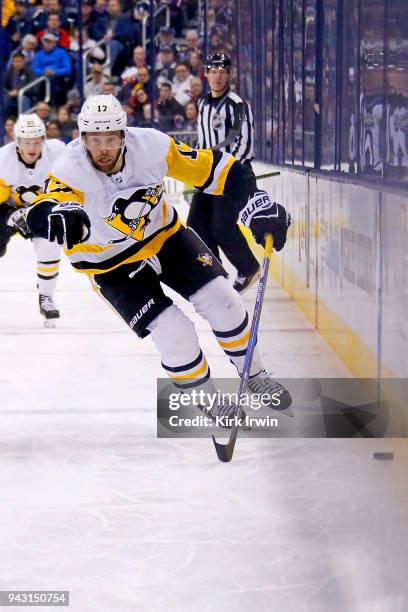 Bryan Rust of the Pittsburgh Penguins controls the puck during the game against the Columbus Blue Jackets on April 5, 2018 at Nationwide Arena in...