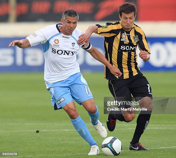 Steve Corica of Sydney FC is tackled by Vince Lia of the Phoenix during the round 18 A-League match between the Wellington Phoenix and Sydney FC at...