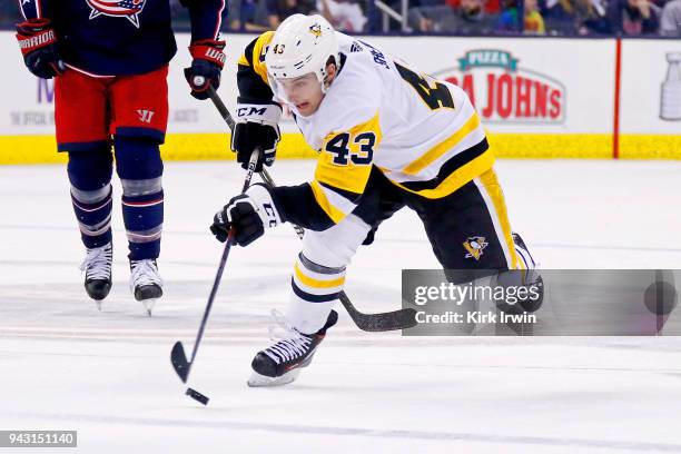 Conor Sheary of the Pittsburgh Penguins controls the puck during the game against the Columbus Blue Jackets on April 5, 2018 at Nationwide Arena in...