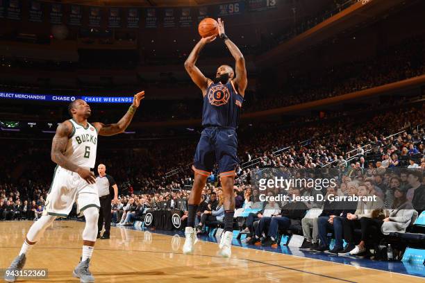 Kyle O'Quinn of the New York Knicks shoots the ball against the Milwaukee Bucks on April 7, 2018 at Madison Square Garden in New York City, New York....