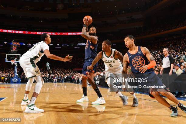 Kyle O'Quinn of the New York Knicks looks to pass against the Milwaukee Bucks on April 7, 2018 at Madison Square Garden in New York City, New York....