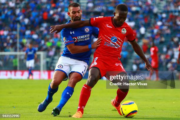 Martin Cauteruccio of Cruz Azul struggles for the ball with Luis Advincula of Lobos BUAP during the 14th round match between Cruz Azul and Lobos BUAP...