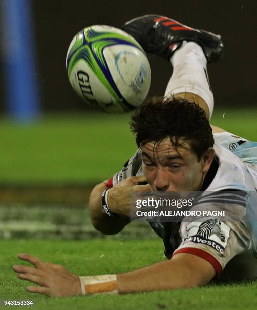 New Zealand's Crusaders fly half Mitchell Hunt scores a try against Argentina's Jaguares during their Super Rugby match at Jose Amalfitani stadium in...