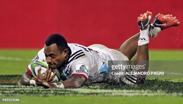 New Zealand's Crusaders wing Manasa Mataele scores a try against Argentina's Jaguares during their Super Rugby match at Jose Amalfitani stadium in...