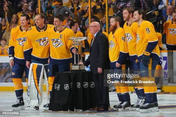 Assistant Commissioner Bill Daly presents the President's Trophy to the Nashville Predators prior to their final regular season game against the...