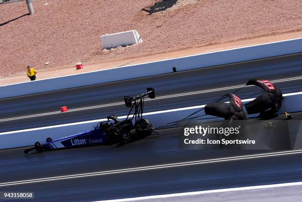 The parachutes open early on the Steven Chrisman NHRA Top Fuel Dragster during qualifying for the NHRA Denso Spark Plugs Four Wide Nationals on April...