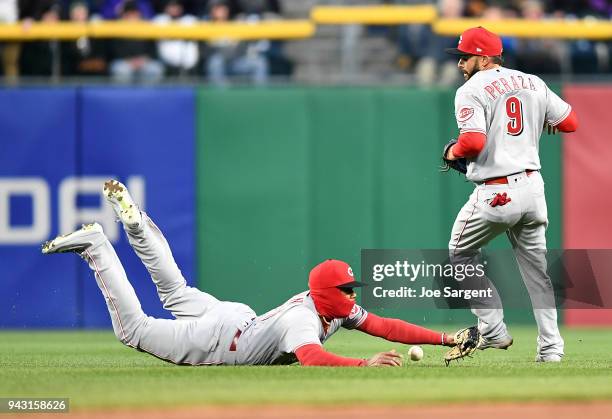 Phillip Ervin of the Cincinnati Reds can't make a catch on a ball hit by Adam Frazier of the Pittsburgh Pirates during the second inning at PNC Park...