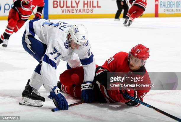 Sebastian Aho of the Carolina Hurricanes and Anthony Cirelli of the Tampa Bay Lightning get tangled up during an NHL game on April 7, 2018 at PNC...