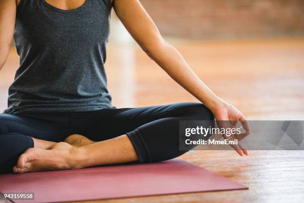 mudra and lotus pose exercises. woman practicing yoga meditation - pranayama stock pictures, royalty-free photos & images
