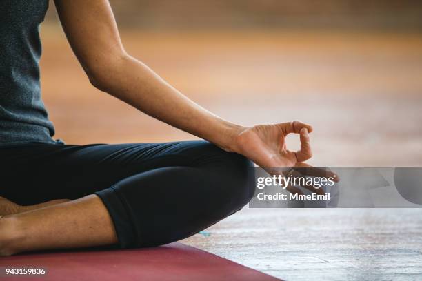 mudra and lotus pose exercises. woman practicing yoga meditation - pranayama stock pictures, royalty-free photos & images