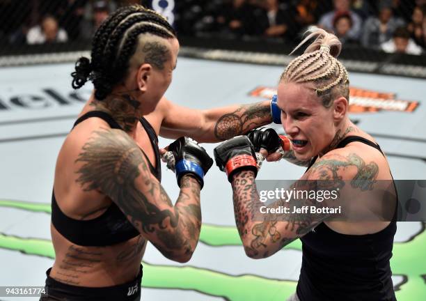 Ashlee Evans-Smith punches Bec Rawlings of Australia in their women's flyweight bout during the UFC 223 event inside Barclays Center on April 7, 2018...