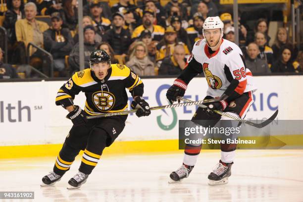 Brad Marchand of the Boston Bruins skates against Magnus Paajarvi of the Ottawa Senators at the TD Garden on April 7, 2018 in Boston, Massachusetts.