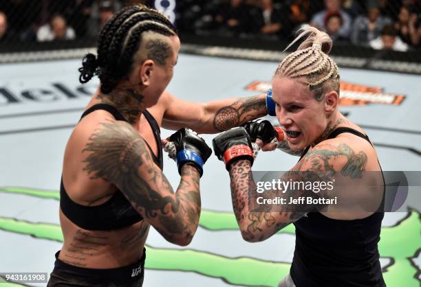 Ashlee Evans-Smith punches Bec Rawlings of Australia in their women's flyweight bout during the UFC 223 event inside Barclays Center on April 7, 2018...