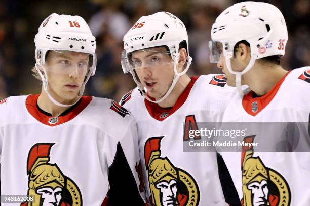 Ryan Dzingel of the Ottawa Senators, Matt Duchene, and Colin White talk during the second period against the Boston Bruins at TD Garden on April 7,...